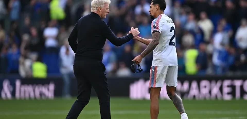 Manager and player shaking hands after match