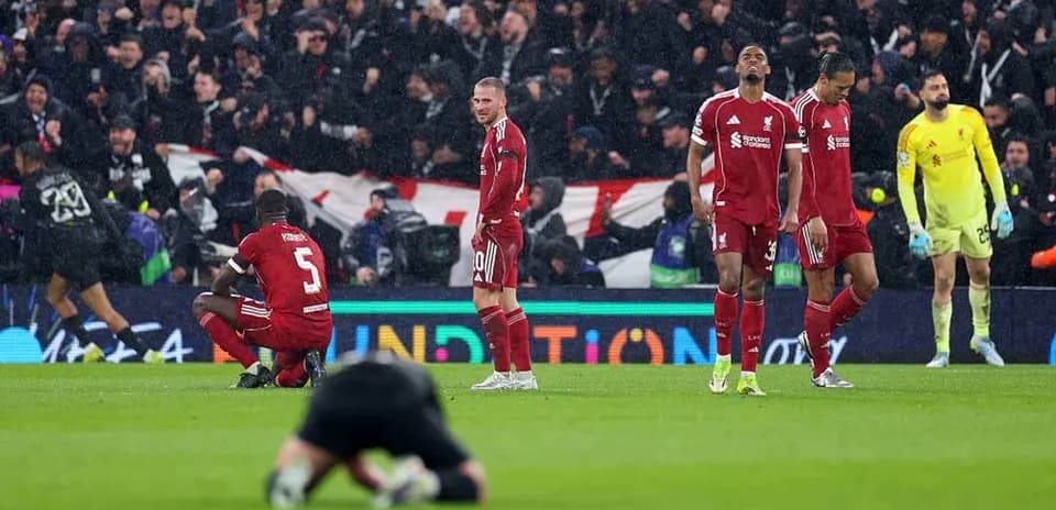 Liverpool players dejected after match loss