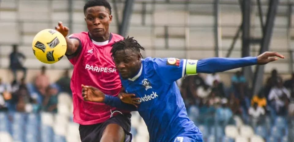 Players competing for the ball during match
