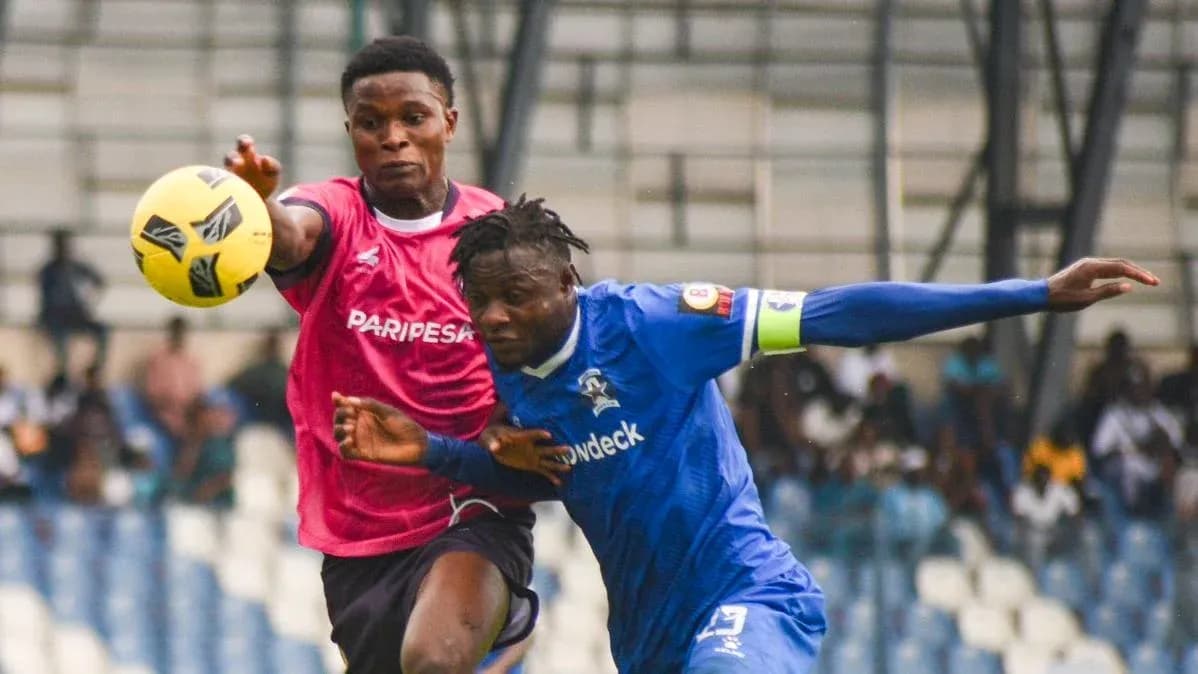 Players competing for the ball during match