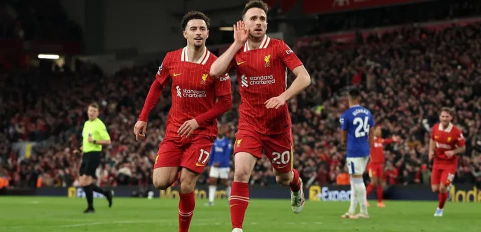 Liverpool players celebrating goal against Everton