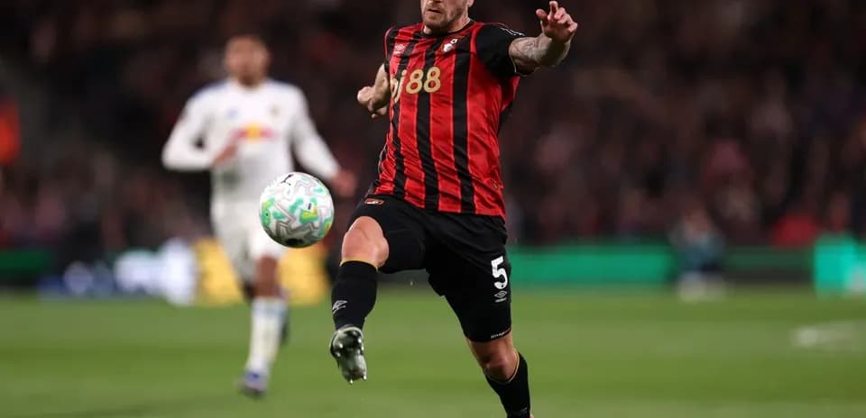 Bournemouth player kicking the ball during match