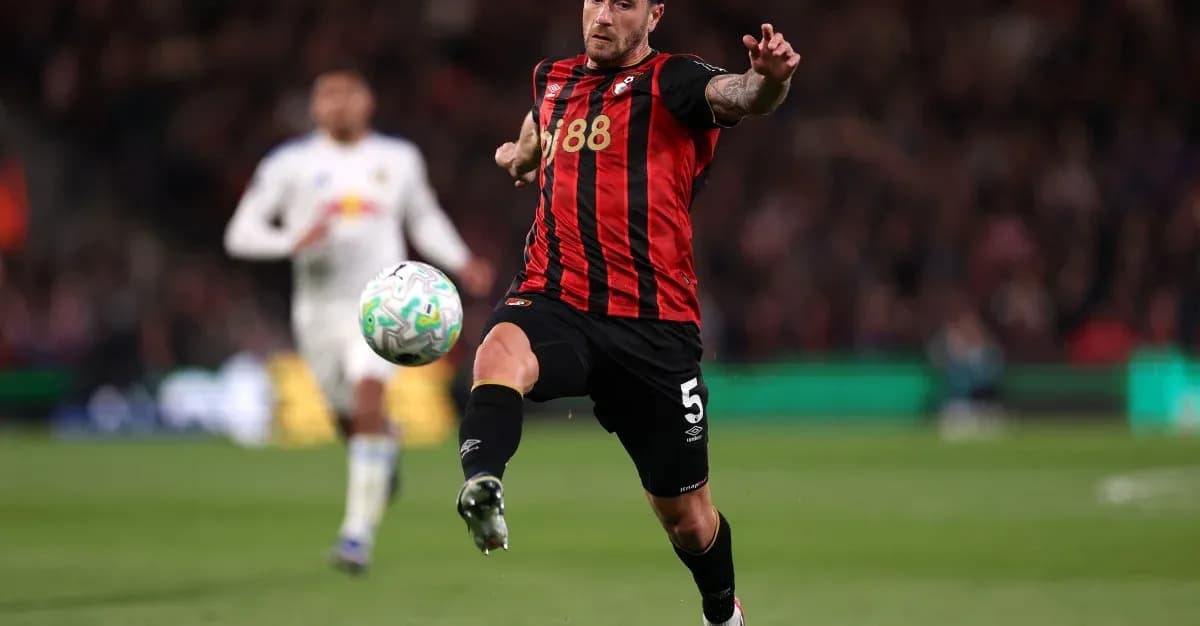 Bournemouth player kicking the ball during match