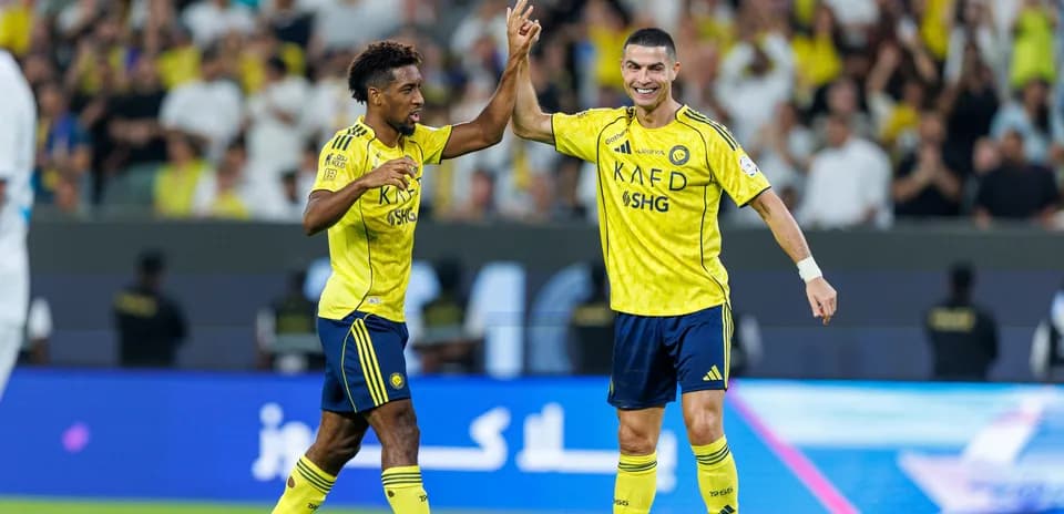 Two players celebrating a goal during match