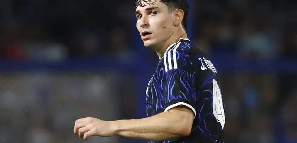 Player wearing a black jersey during match action