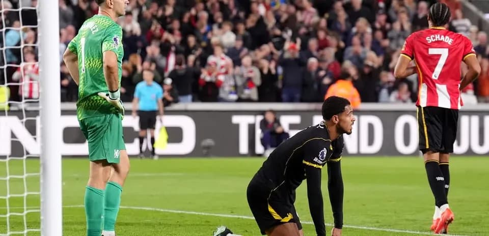 Goalkeeper and players reacting after a goal scored