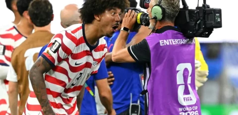 US player celebrating while talking to cameraman