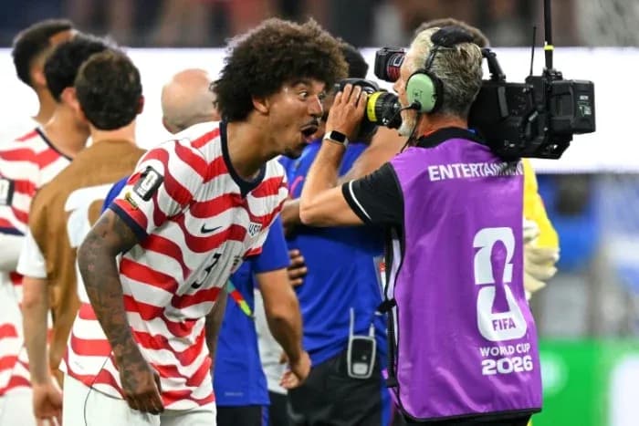 US player celebrating while talking to cameraman
