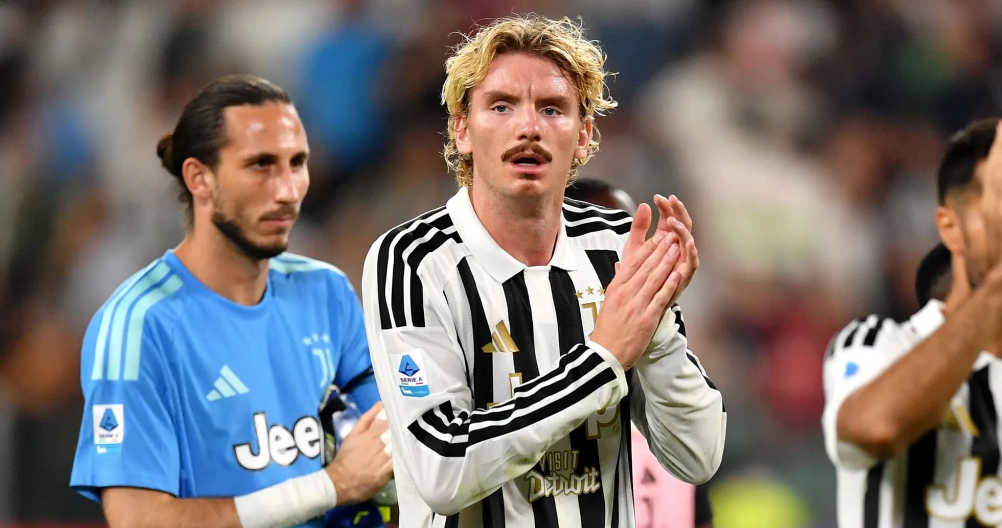 Juventus players applauding fans after a match