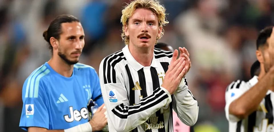 Juventus players applauding fans after a match