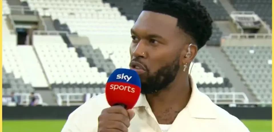 Sports commentator speaking with microphone on field