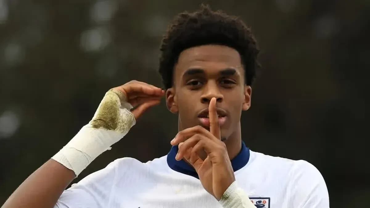 Player making shushing gesture during match celebration