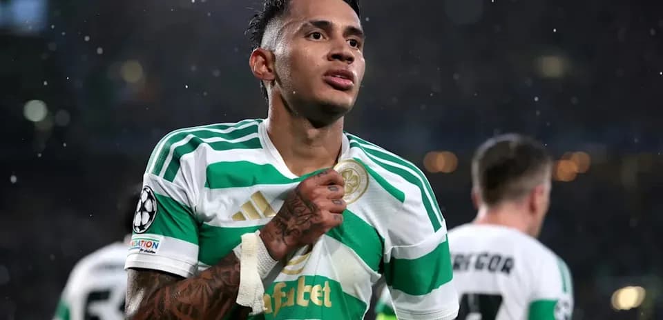 Player celebrating in Celtic's green and white jersey