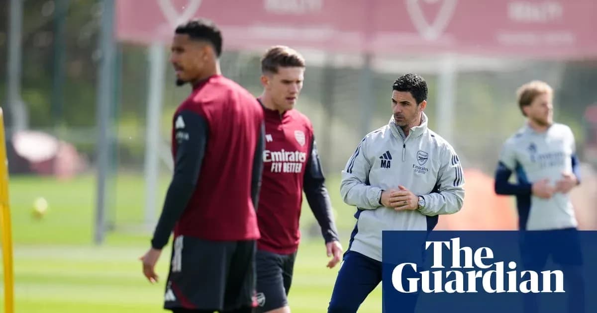 Arsenal players training with manager at practice session