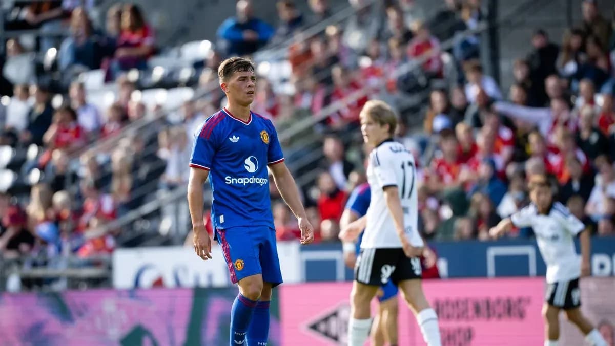 Player in blue jersey on field during match