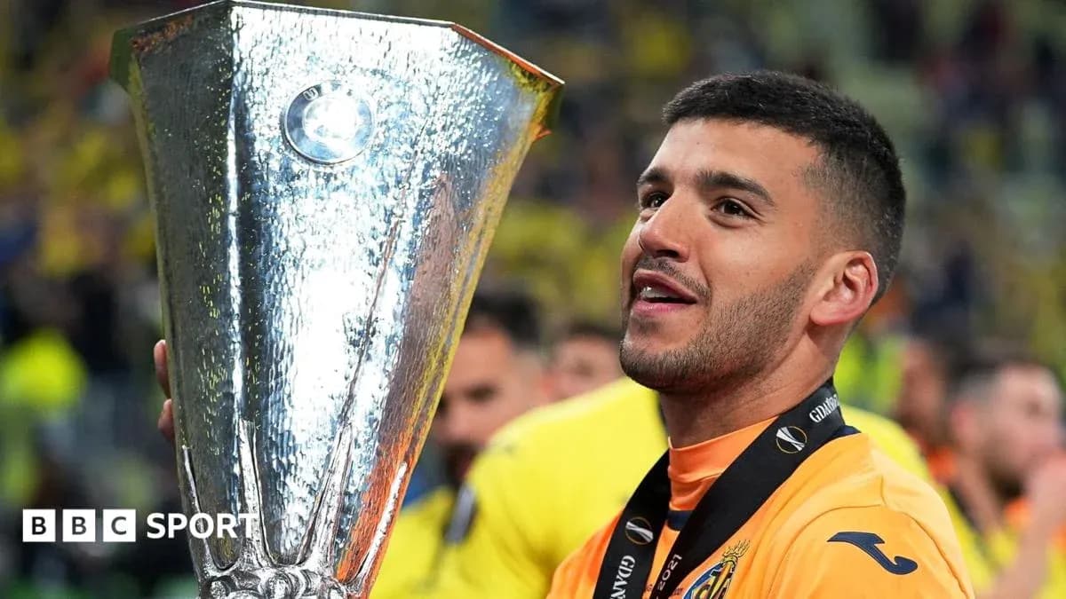 Player celebrating with UEFA Europa League trophy