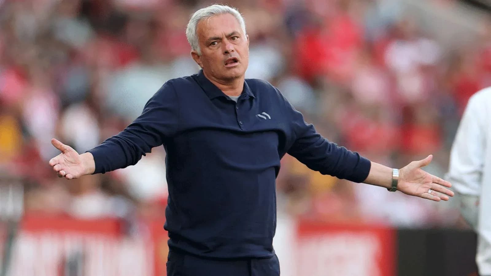 Coach gesturing during a football match