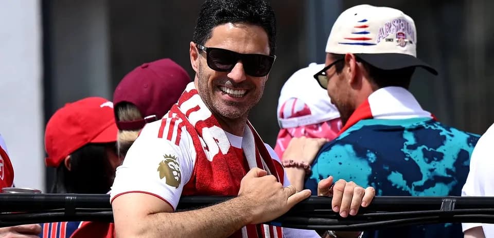 Fan wearing Arsenal gear at celebratory event