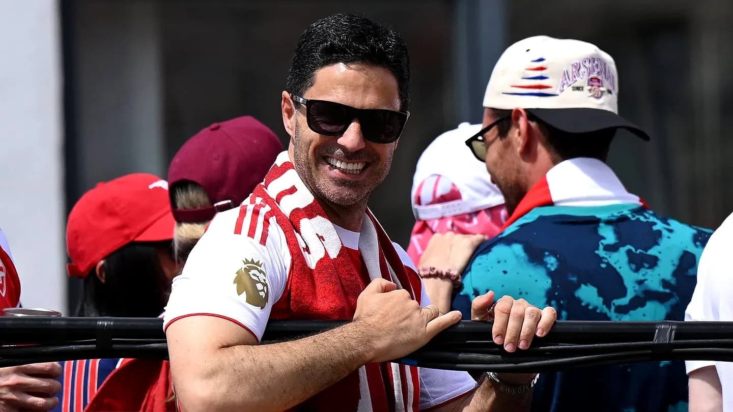 Fan wearing Arsenal gear at celebratory event