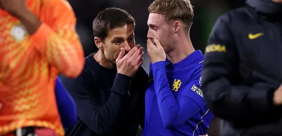 Coach discussing with player after the match