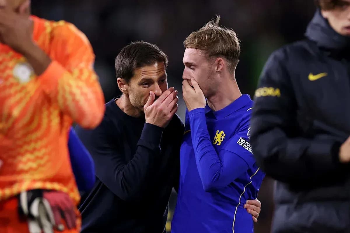 Coach discussing with player after the match