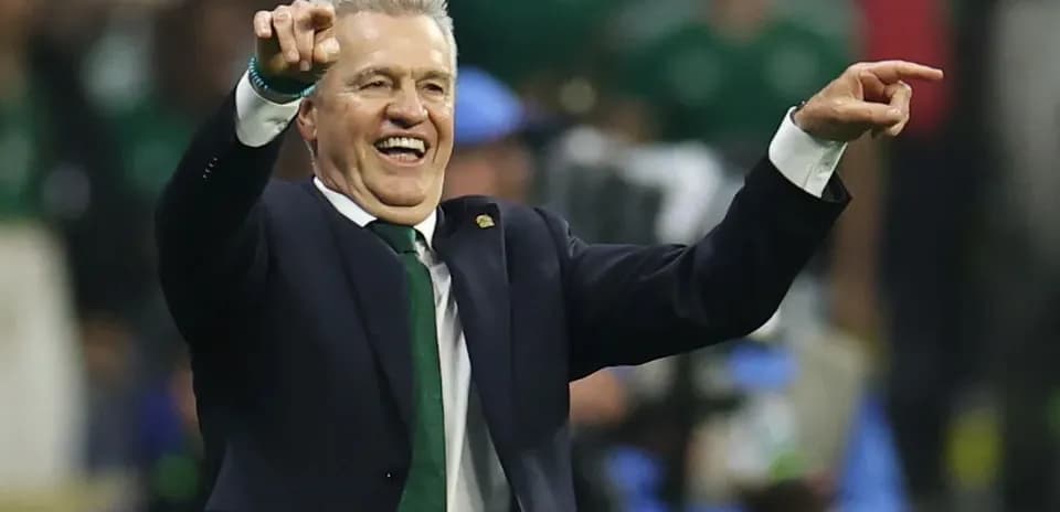 Coach celebrating and pointing during match