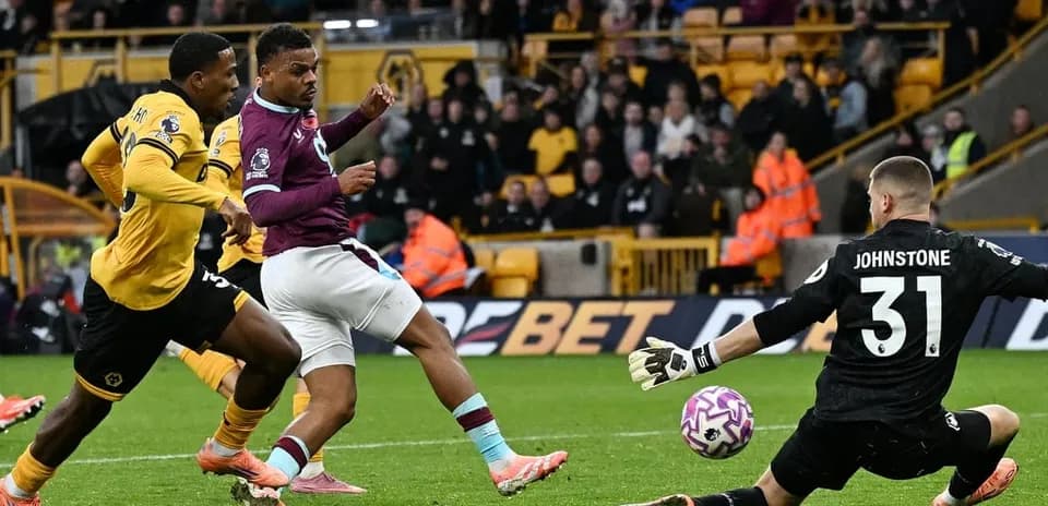 Burnley player attempting to score against Wolves