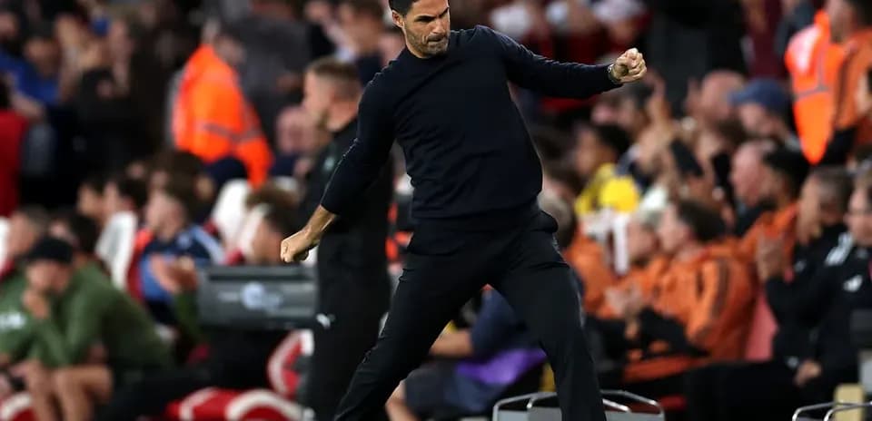 Manager celebrating during a match on the sideline