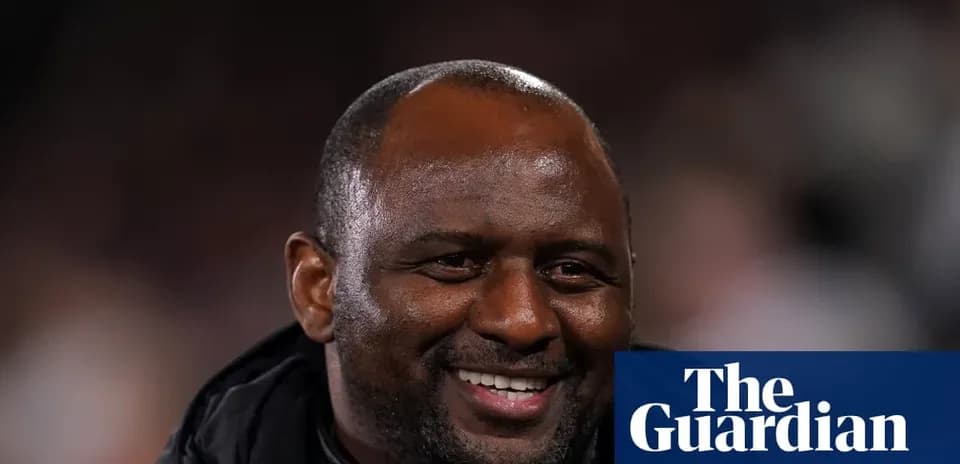 Smiling coach during a football match event