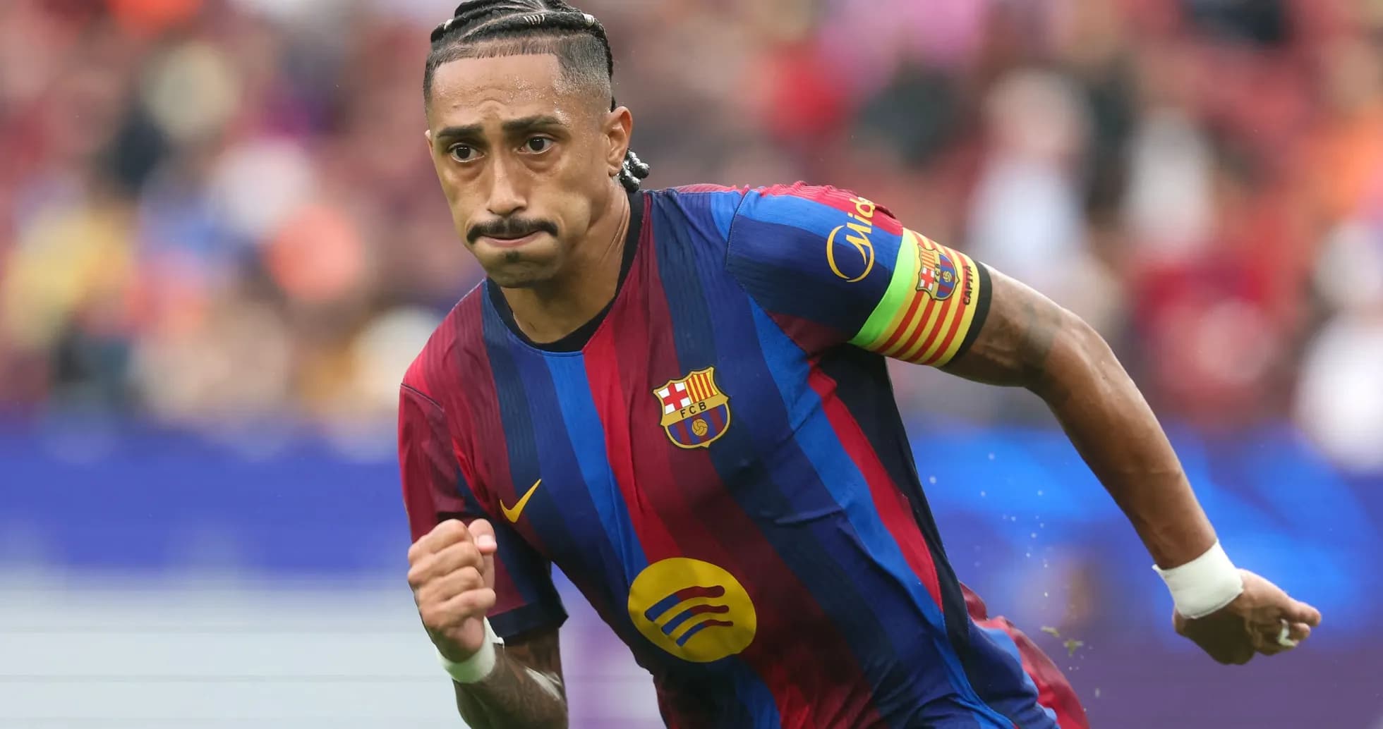 Player running during a FC Barcelona match