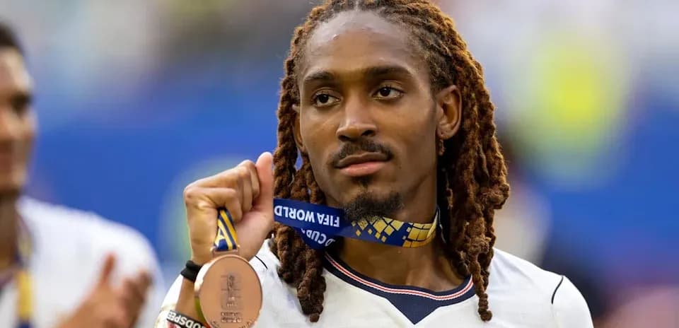 Player holding bronze medal after FIFA World Cup