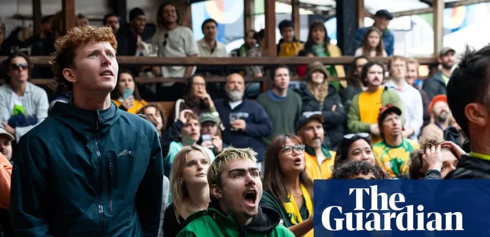 Crowd of fans watching a sports event indoors