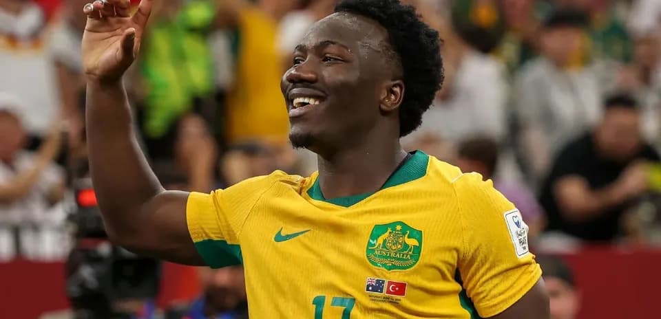 Player celebrating during a match in yellow jersey