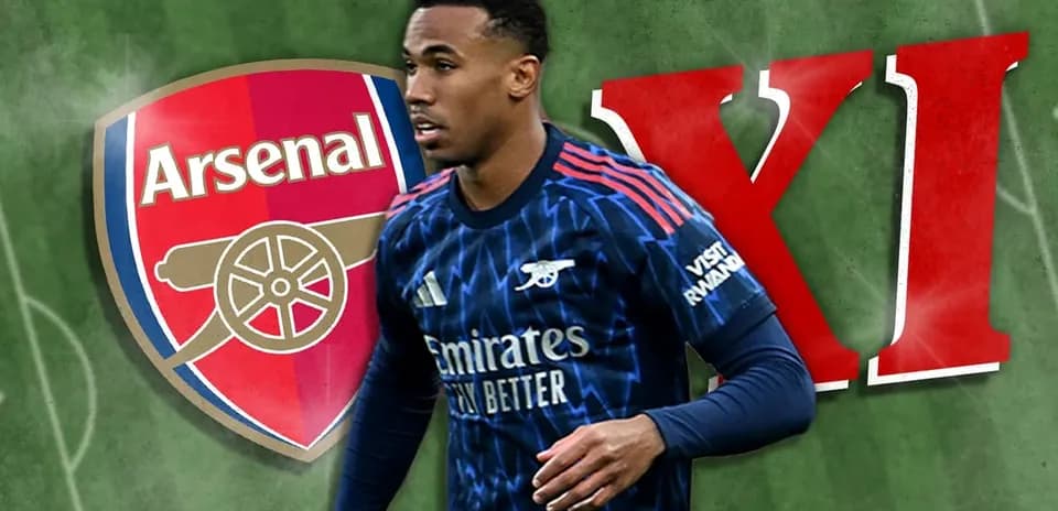 Arsenal player in team kit with club logo background