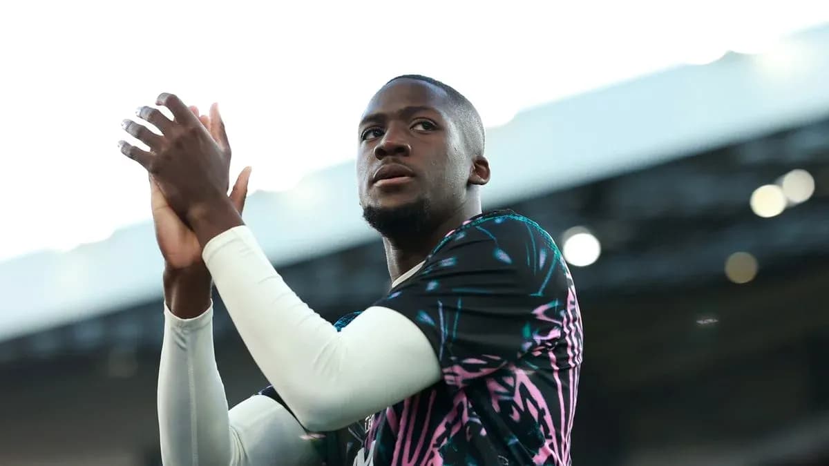 Player applauding fans in colorful training kit