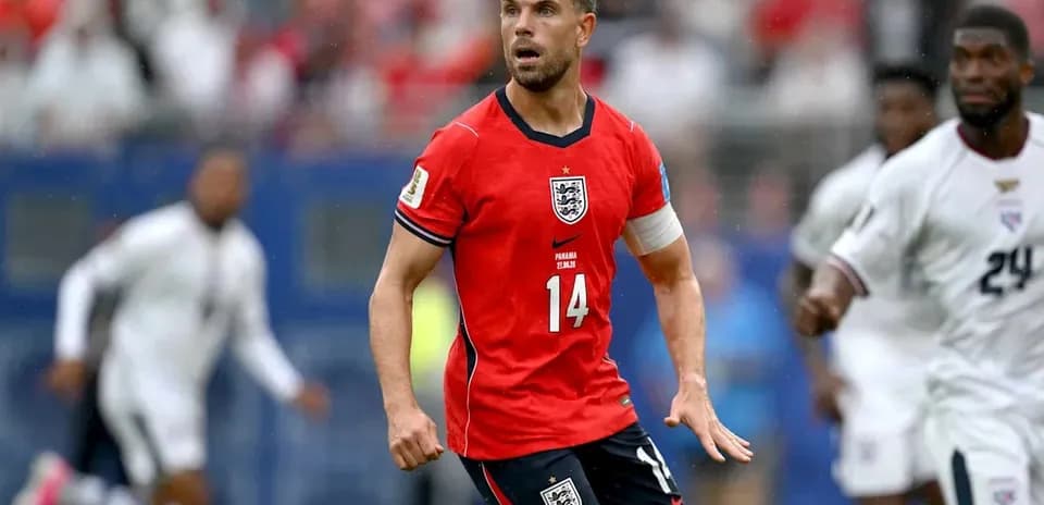 Player wearing red England jersey during match