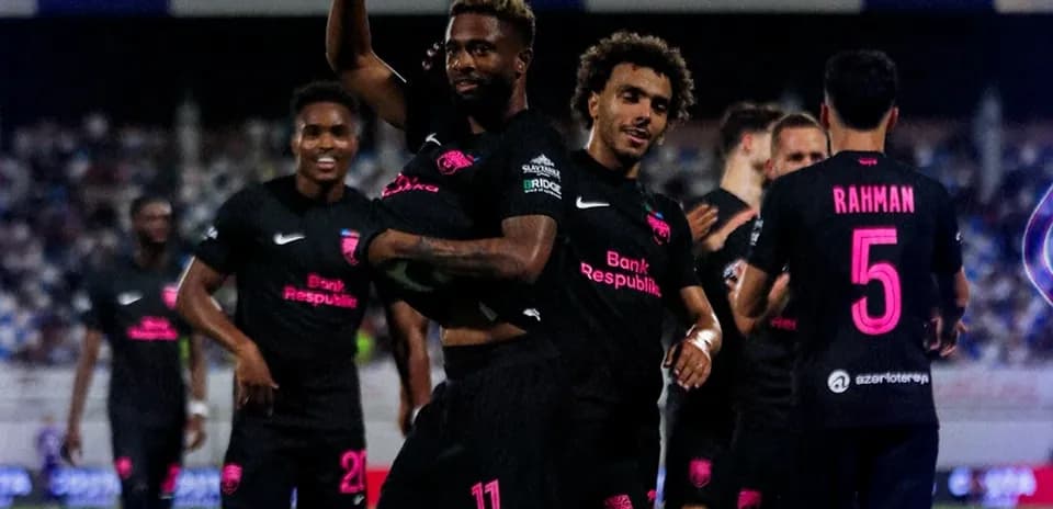 Players celebrating a goal during the match
