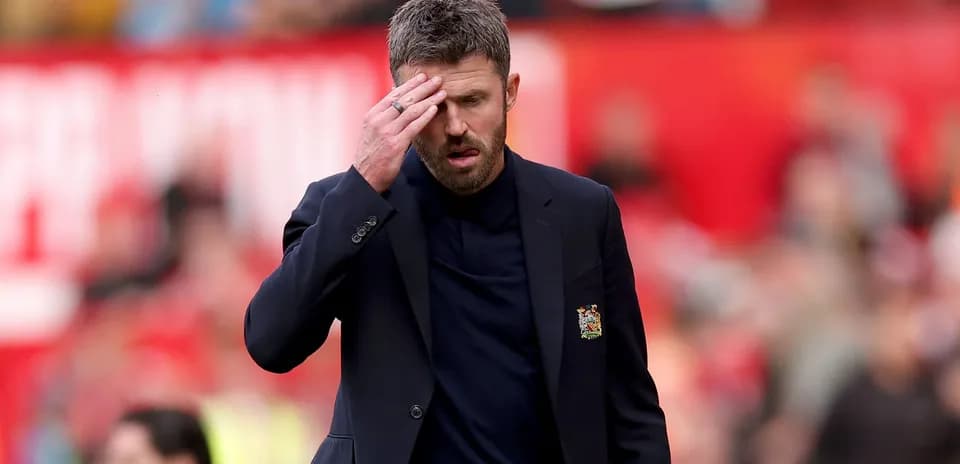 Coach walking with hand on forehead during match
