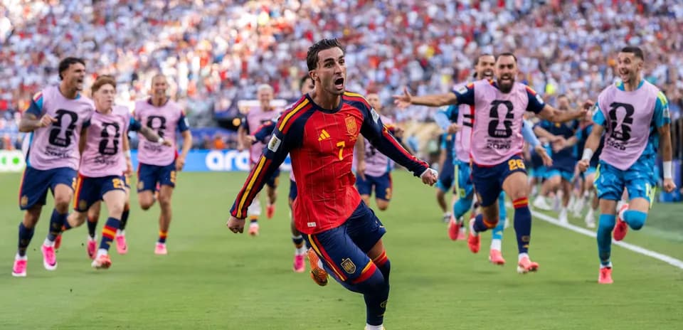 Spanish player celebrating goal with teammates during match