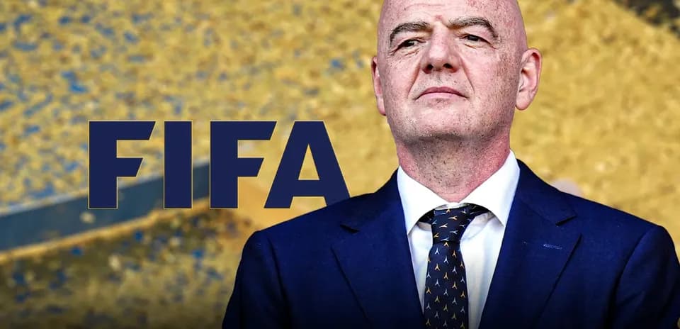 FIFA logo with official addressing event speaker