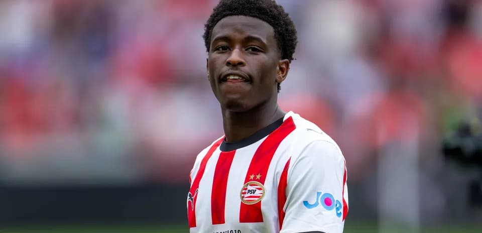 Player in PSV kit during match warm-up