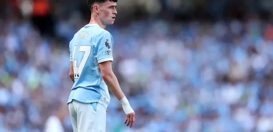 Phil Foden in Manchester City kit on the pitch