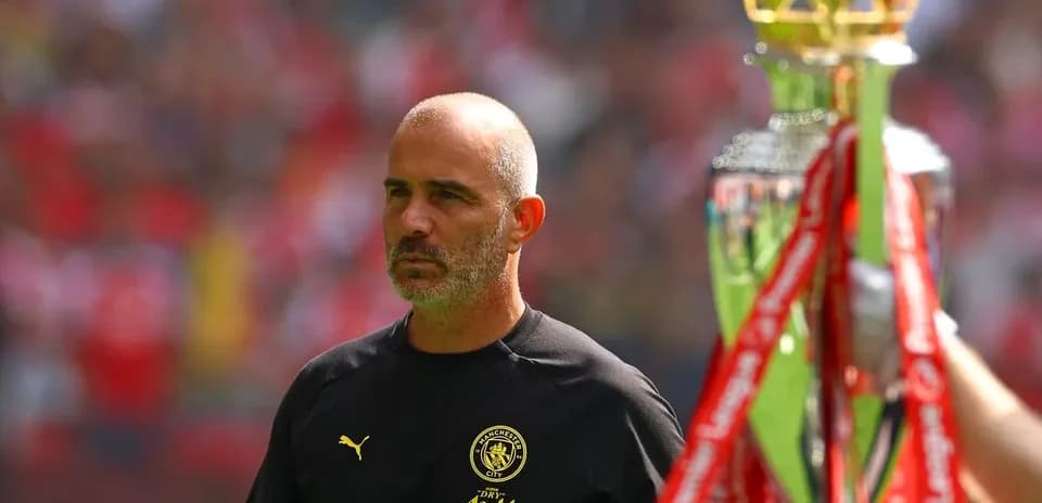 Manager observing trophy presentation during match