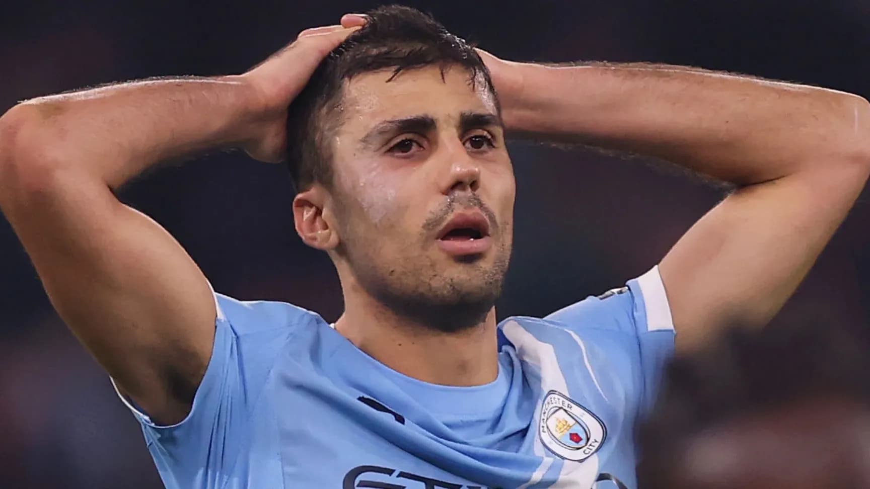 Player holding head in distress during match