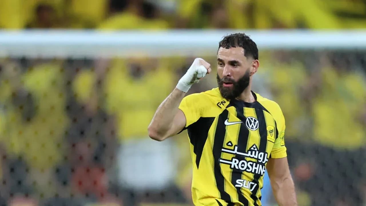 Player celebrating a goal in yellow and black jersey