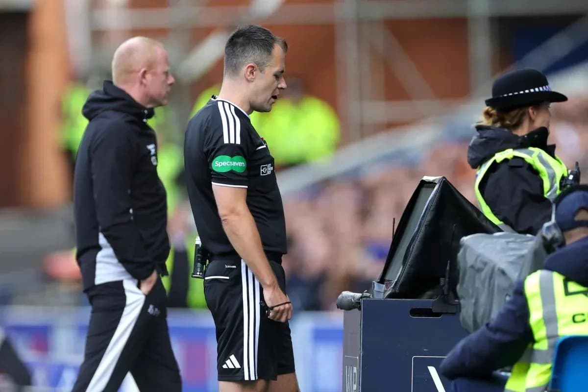 Referee reviewing a decision at VAR monitor