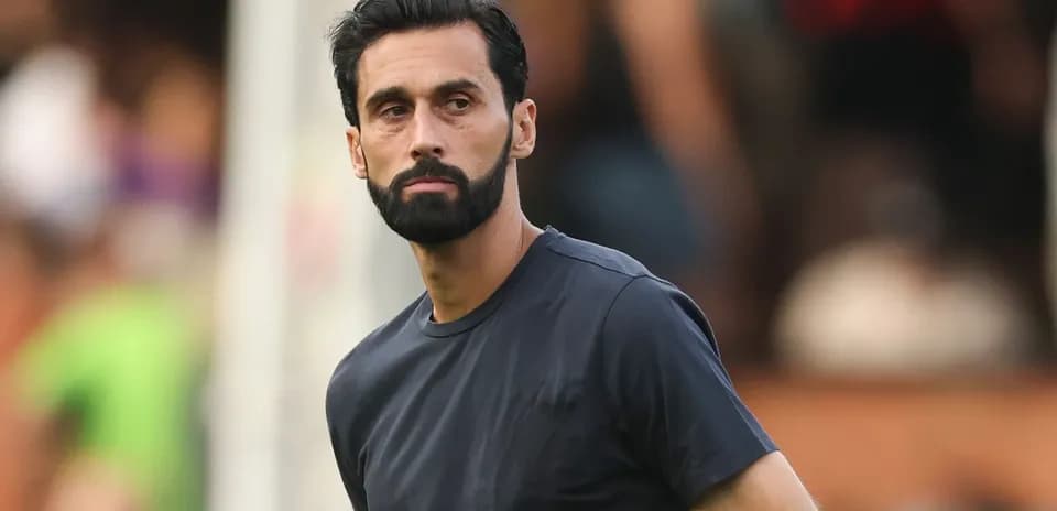 Coach observing players during training session
