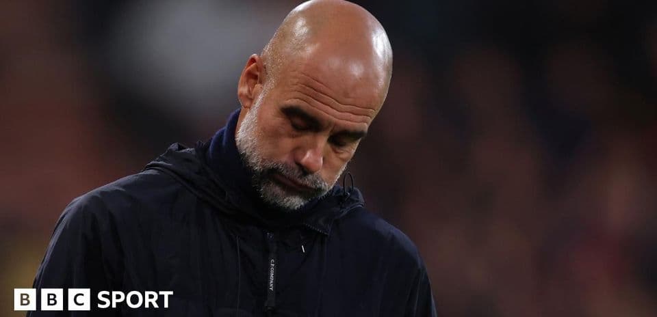 Manager looking down during a match