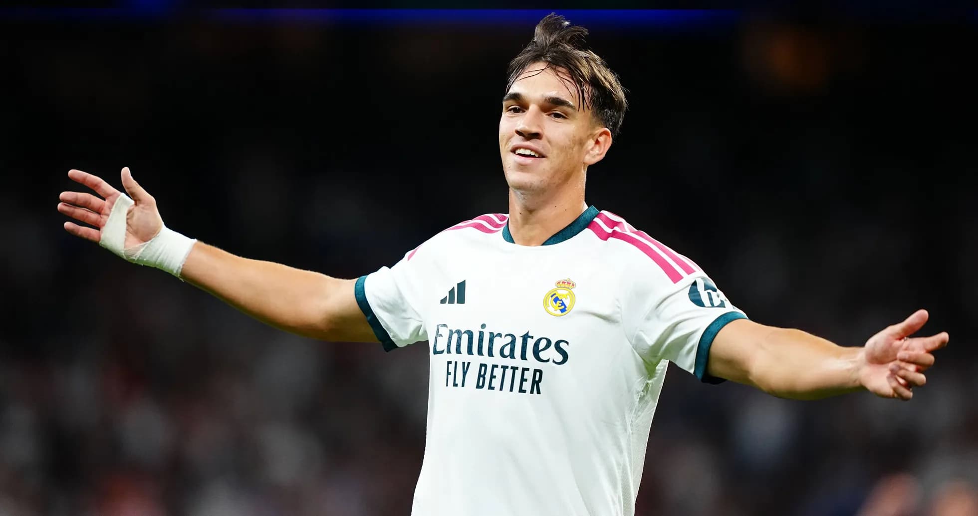 Player celebrating in Real Madrid jersey on pitch