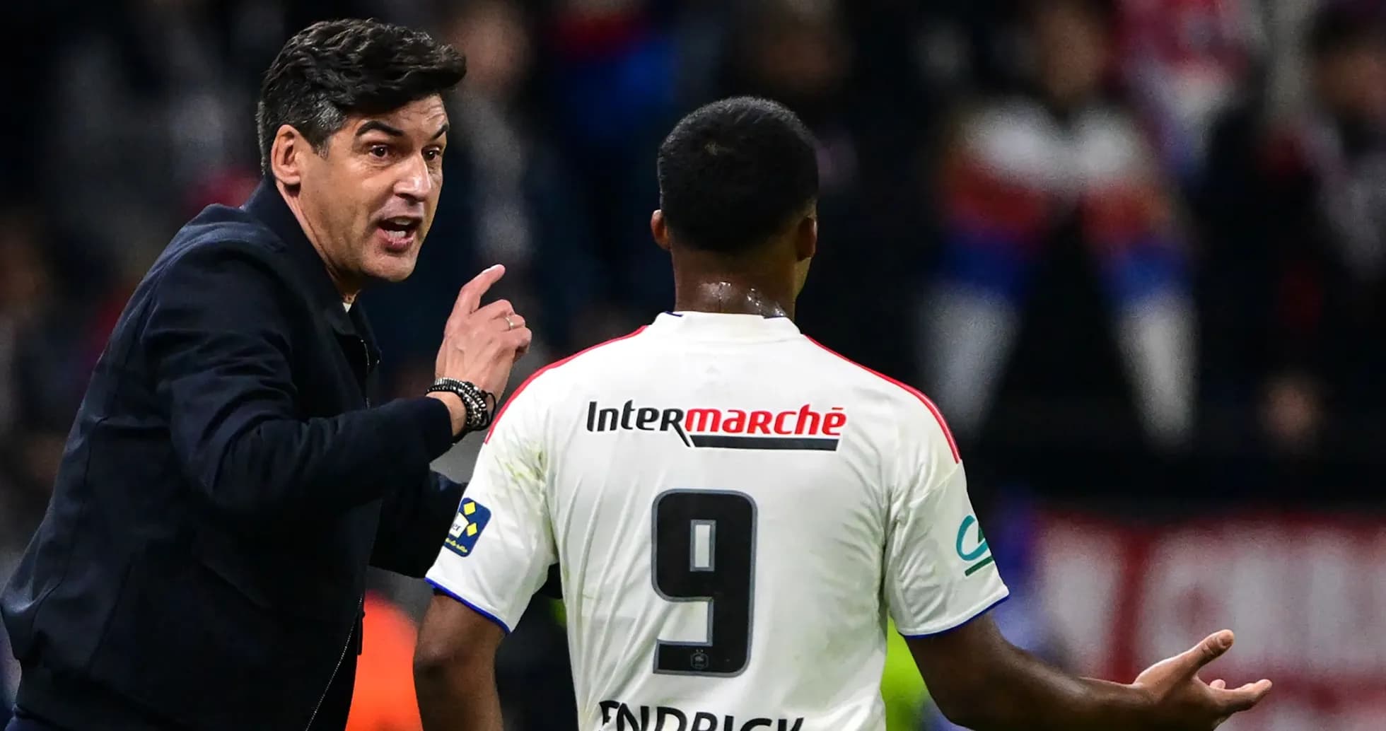 Coach instructing player during match on sideline